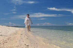 Jennifer Knight Mason reflective beach journey Jennifer Knight Mason walking along a quiet beach reflecting on travel, creativity and human connection